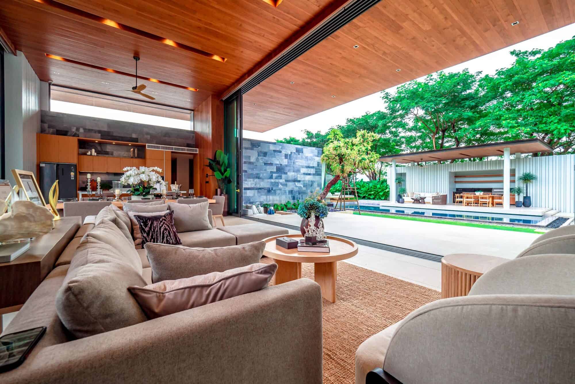 Botanica Forestique villa living room opening to pool, Cherngtalay, Phuket